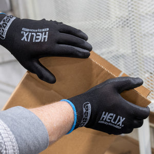 worker wearing Helix® 1030 holding a box