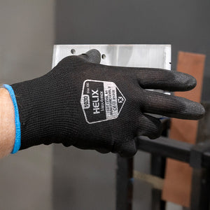 worker wearing Helix® 1030 holding a box