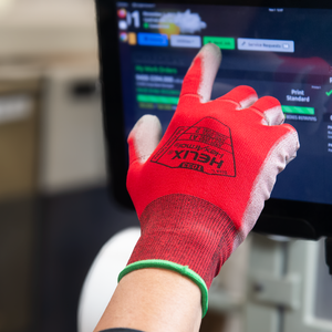 worker using a touch screen panel wearing Helix® 1033