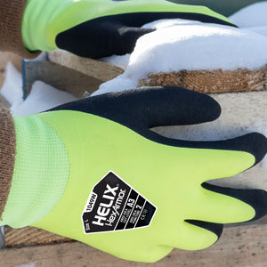 worker holding a wood pallet in the winter wearing Helix® 1049W