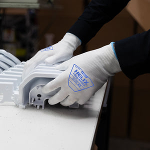 worker holding parts wearing Helix® 1051