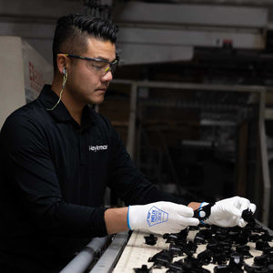 worker sorting parts wearing Helix® 1051