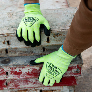 worker stacking metal beams wearing Helix® 1081