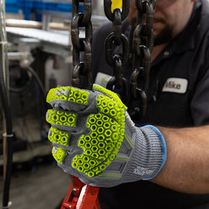 worker holding a chain wearing Helix® 3013IMP