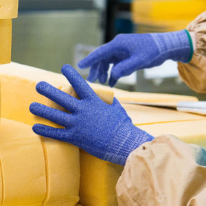 worker handling cheese wearing Helix® 3033