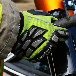 firefighter wearing EXT Rescue® 4011 holding a rescue tool