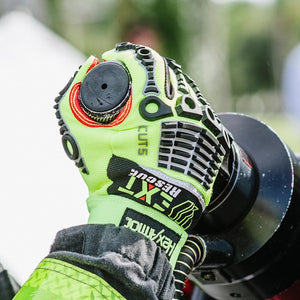 firefighter wearing EXT Rescue® 4012 holding a rescue tool