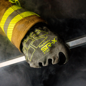 firefighter wearing FireArmor® SR-X® 8180 holding a crow bar