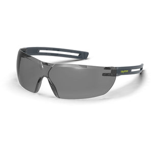 Grey LT400 anti-fog safety glasses shown as they are sitting on a table.