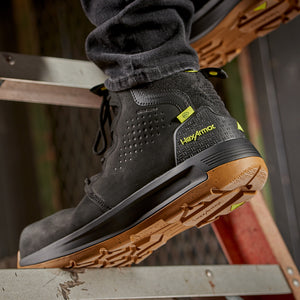 Construction worker standing in Xtend black safety boots on a step.
