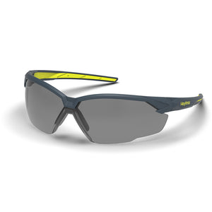 Grey 23% NX1 anti-fog safety glasses shown as they are sitting on a table.