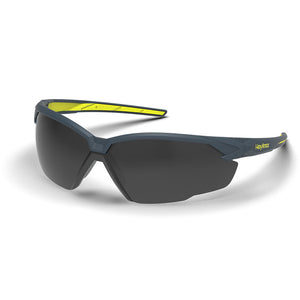 Grey and yellow NX1 weld shade safety glasses shown as they are sitting on a table.