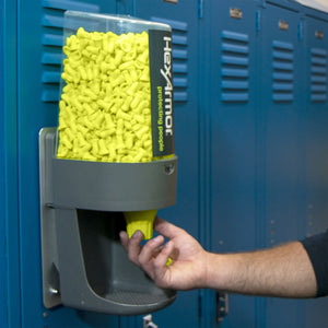 Turn2® refillable earplug dispenser attached to locker with worker getting eargplugs