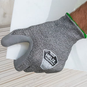 worker holding a white panel wearing Helix® 3084