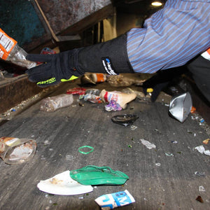 Waste worker sorting through trash wearing PointGuard Ultra 6044