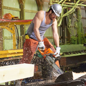 wood worker wearing SteelLeather 5033 using a chainsaw