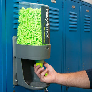 Hexarmor magnetic turn2 refillable earplug dispenser being used by a worker