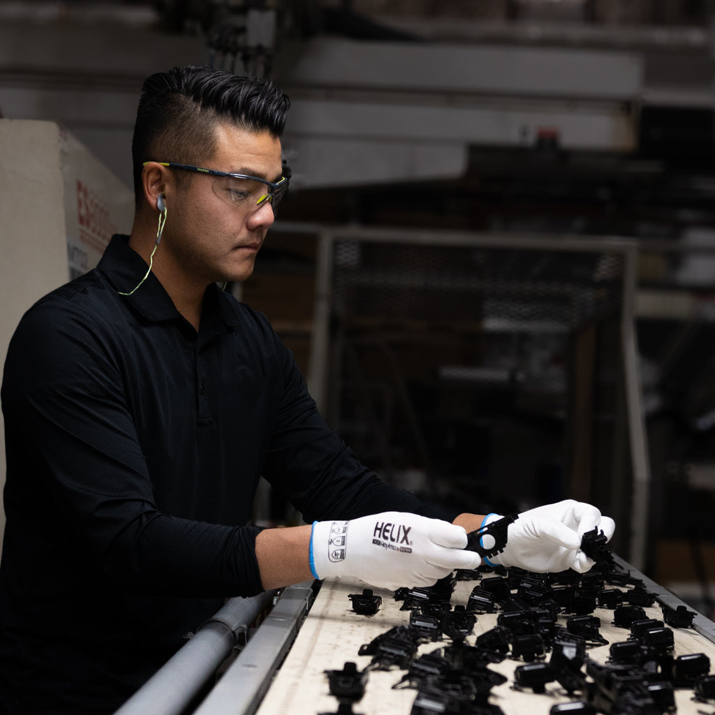 worker sorting parts wearing Helix® 1031