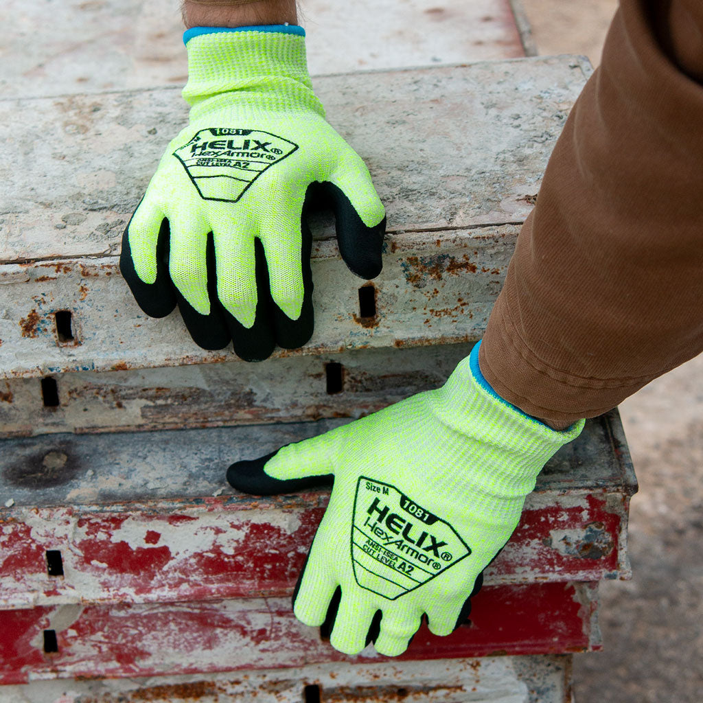 worker stacking metal beams wearing Helix® 1081