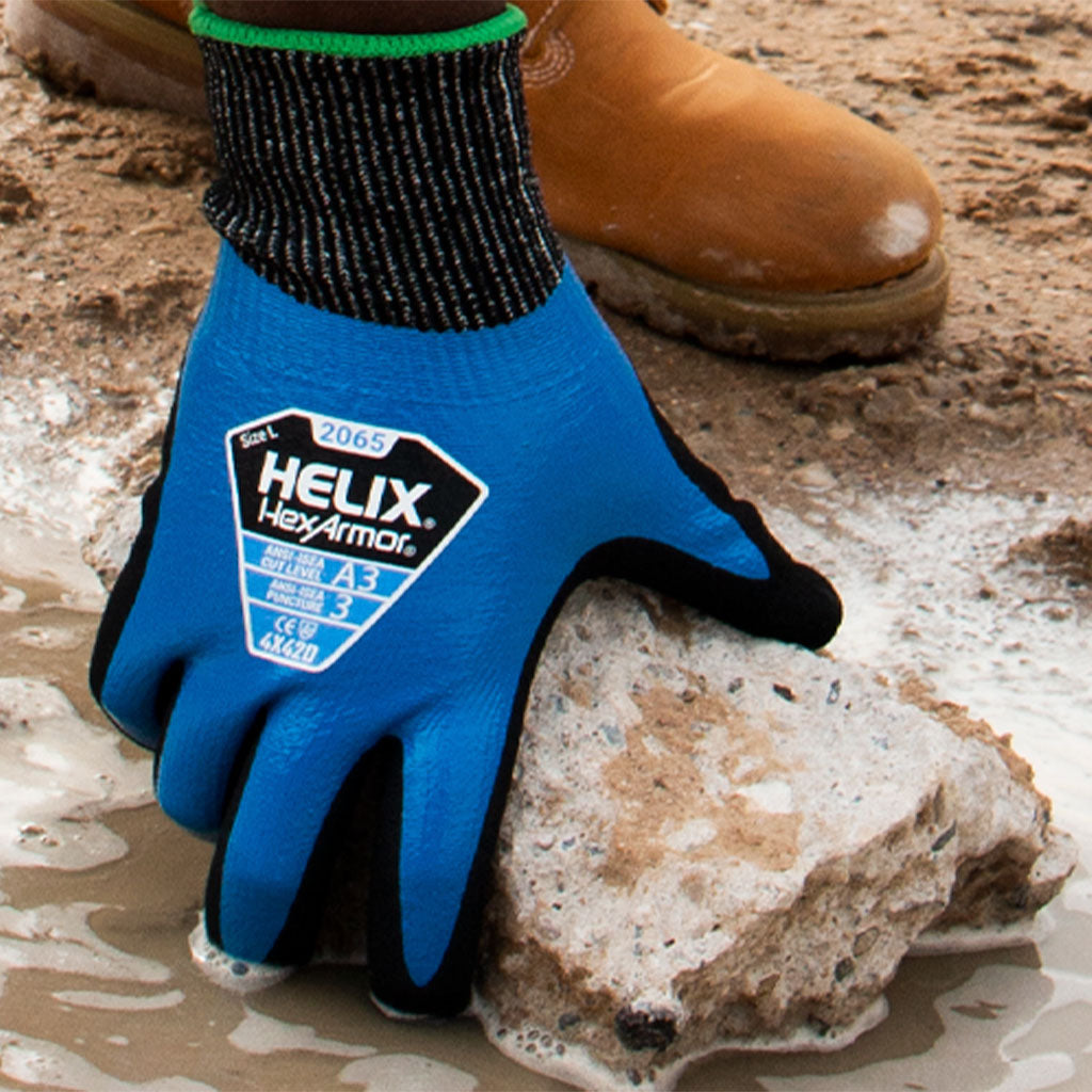 worker hand in water grabbing a piece of concrete wearing Helix® 2065