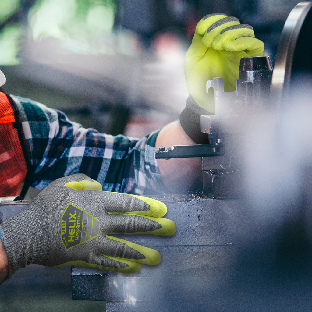 working guiding a part through a machine wearing Helix® 3014