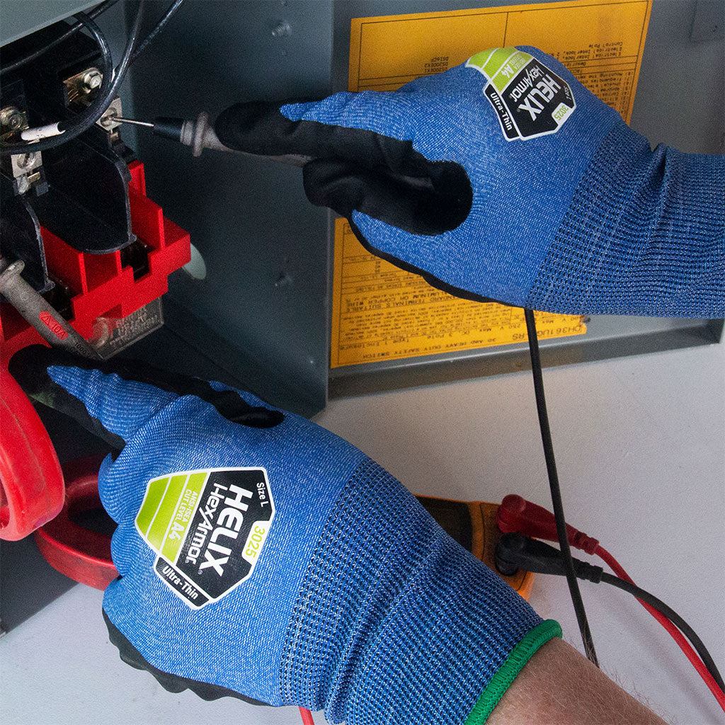 electrician testing wire wearing Helix® 3025 