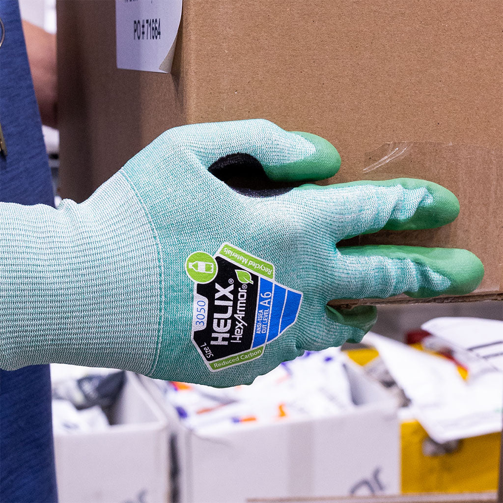 warehouse working holding a box wearing Helix® 3050