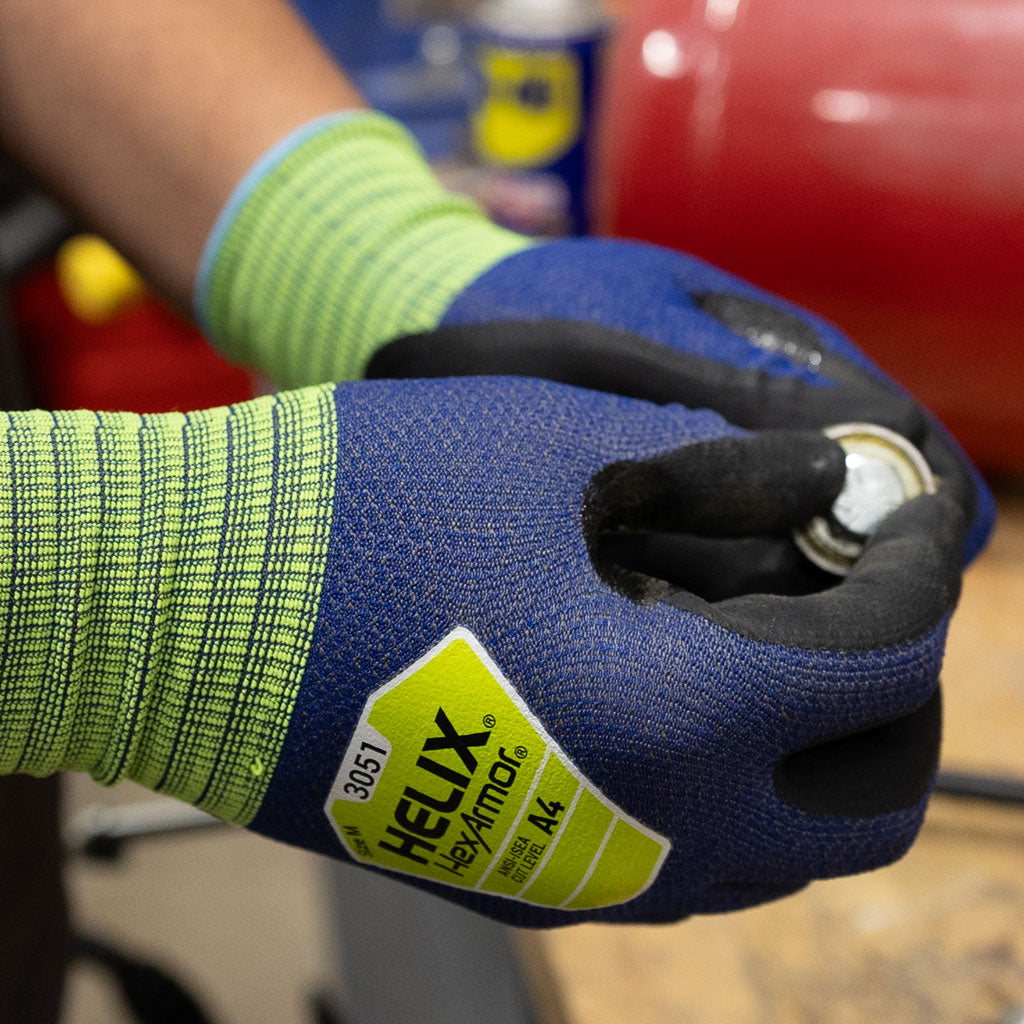 worker holding a bolt wearing Helix® 3051