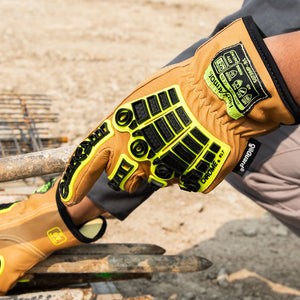 Hands wearing chrome slt 5073imp impact leather gloves with water and oil resistant sustainable leather treatment.