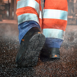 Worker walking on hot asphalt in HeatArmor™ comfortable safety boots.
