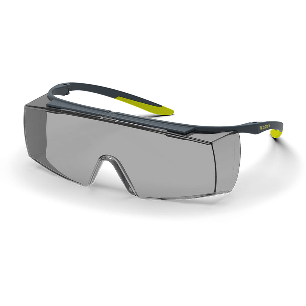 Grey and yellow LT250 OTG grey safety glasses shown as they are sitting on a table.