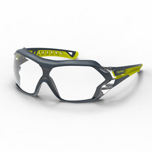 Grey and yellow MX225G anti-fog safety glasses with gasket shown as they are sitting on a table.