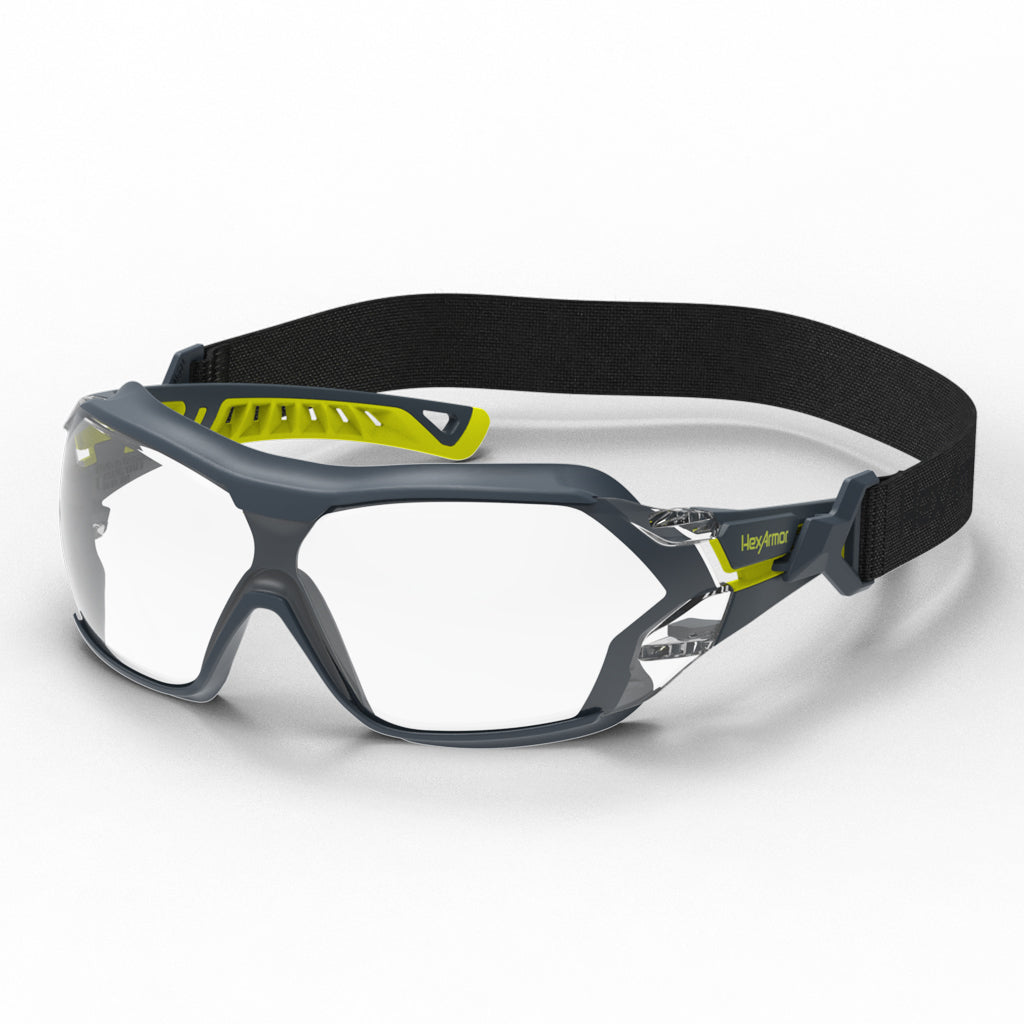 Grey and yellow MX225G with strap anti-fog safety glasses shown as they are sitting on a table.