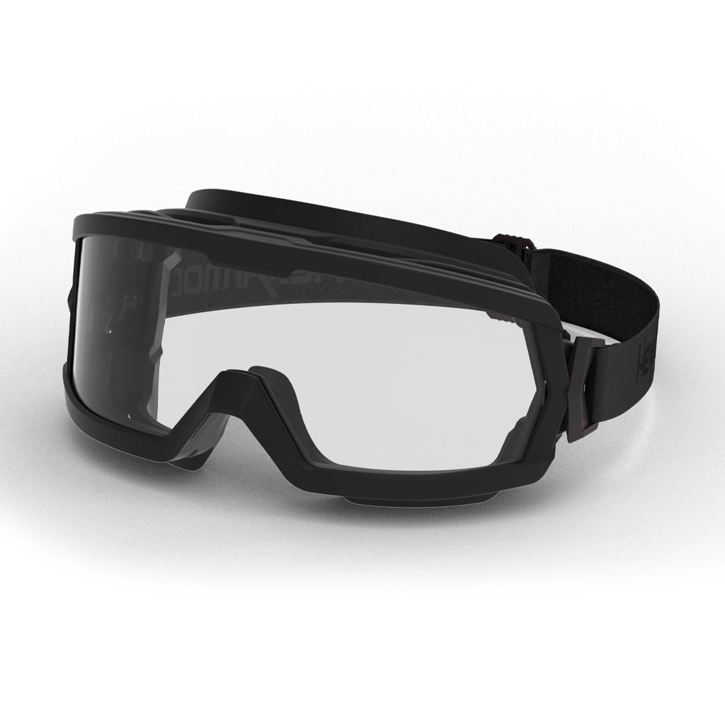 Black MX600 wildland safety goggles shown as they are sitting on a table.
