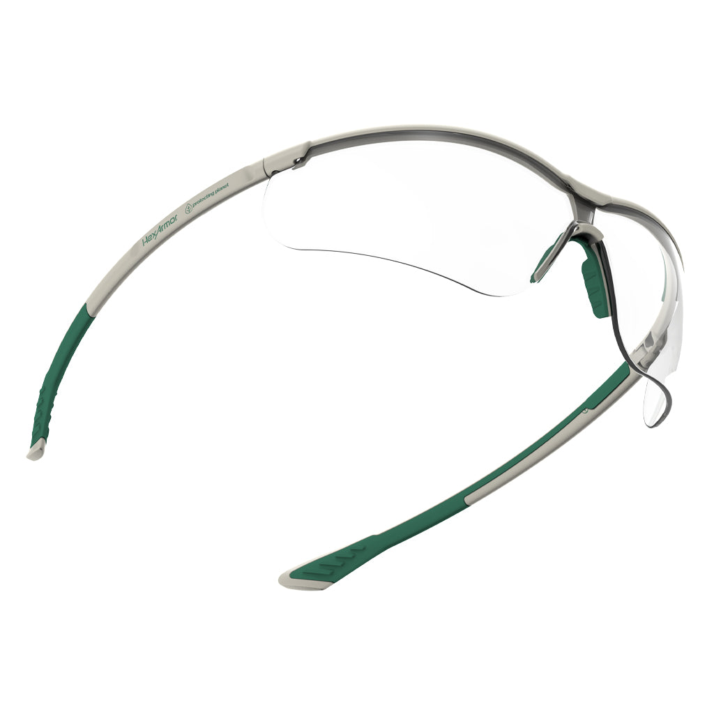 Green and white VS250 planet series sustainable premium safety glasses showcasing the optical clarity of the lenses. 
