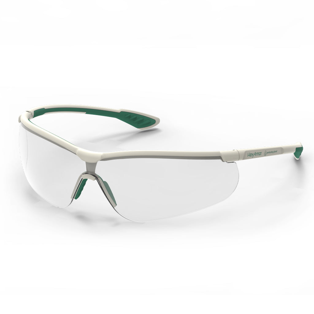 Green and white VS250 planet series sustainable anti-fog safety glasses shown as they are sitting on a table.