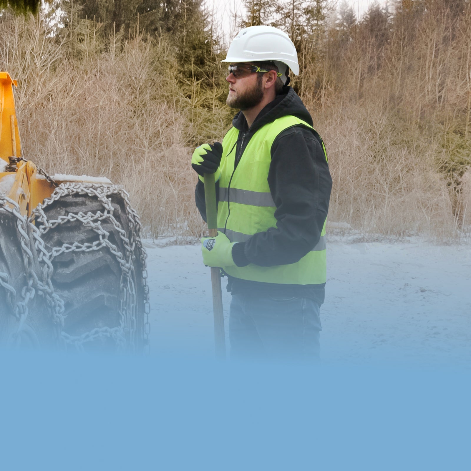 Worker holding shovel wearing HexArmor cold weather gear
