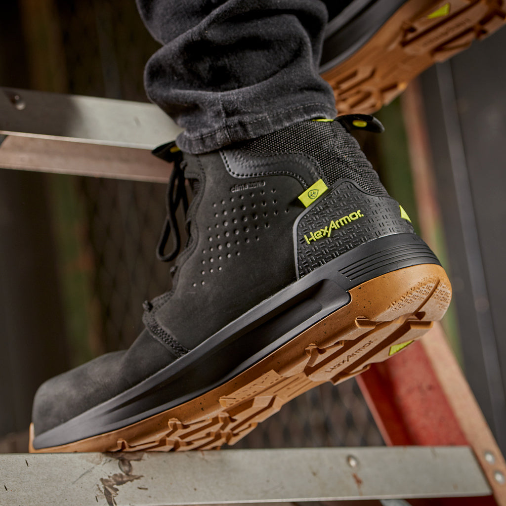 Construction worker standing in Xtend black safety boots on a step. 