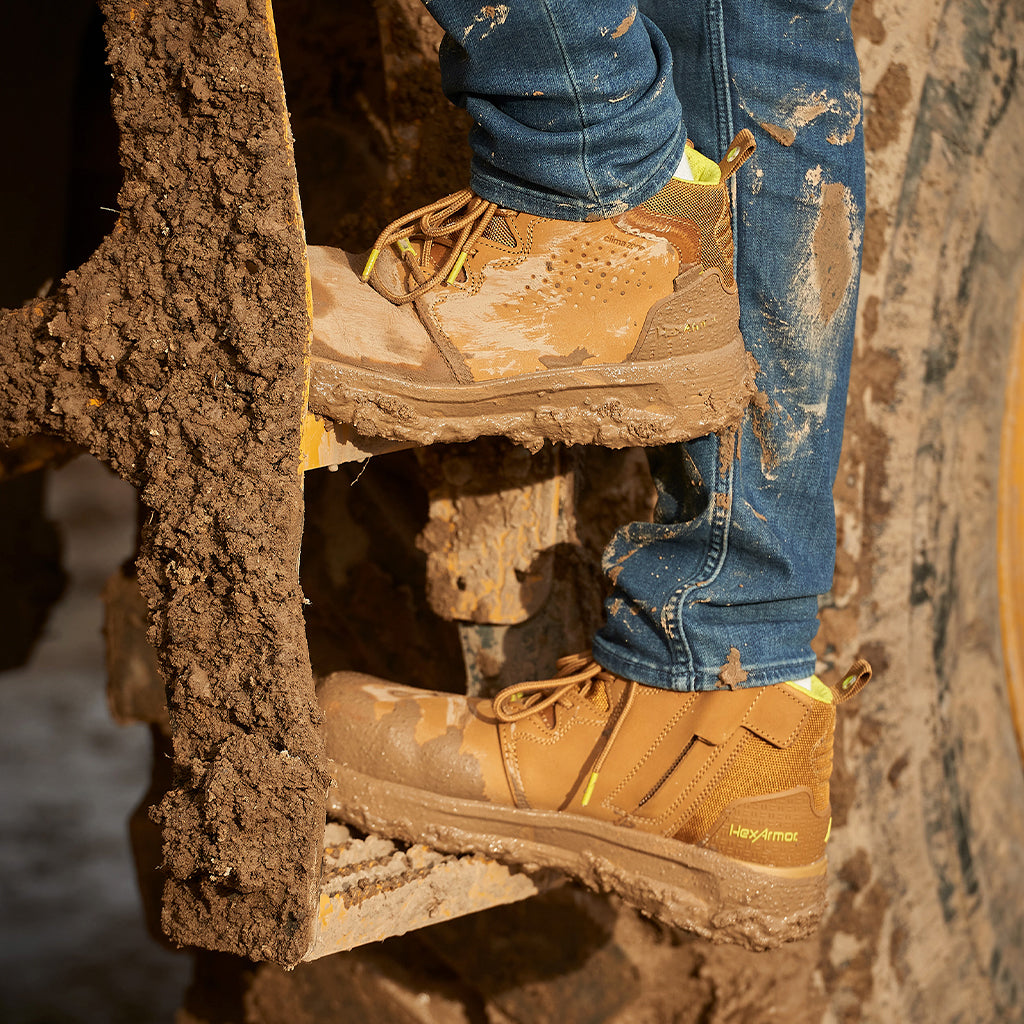 Construction worker standing in Xtend tan safety boots.