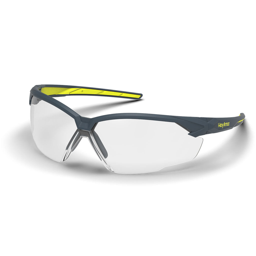 Grey and yellow NX1 anti-fog safety glasses shown as they are sitting on a table.